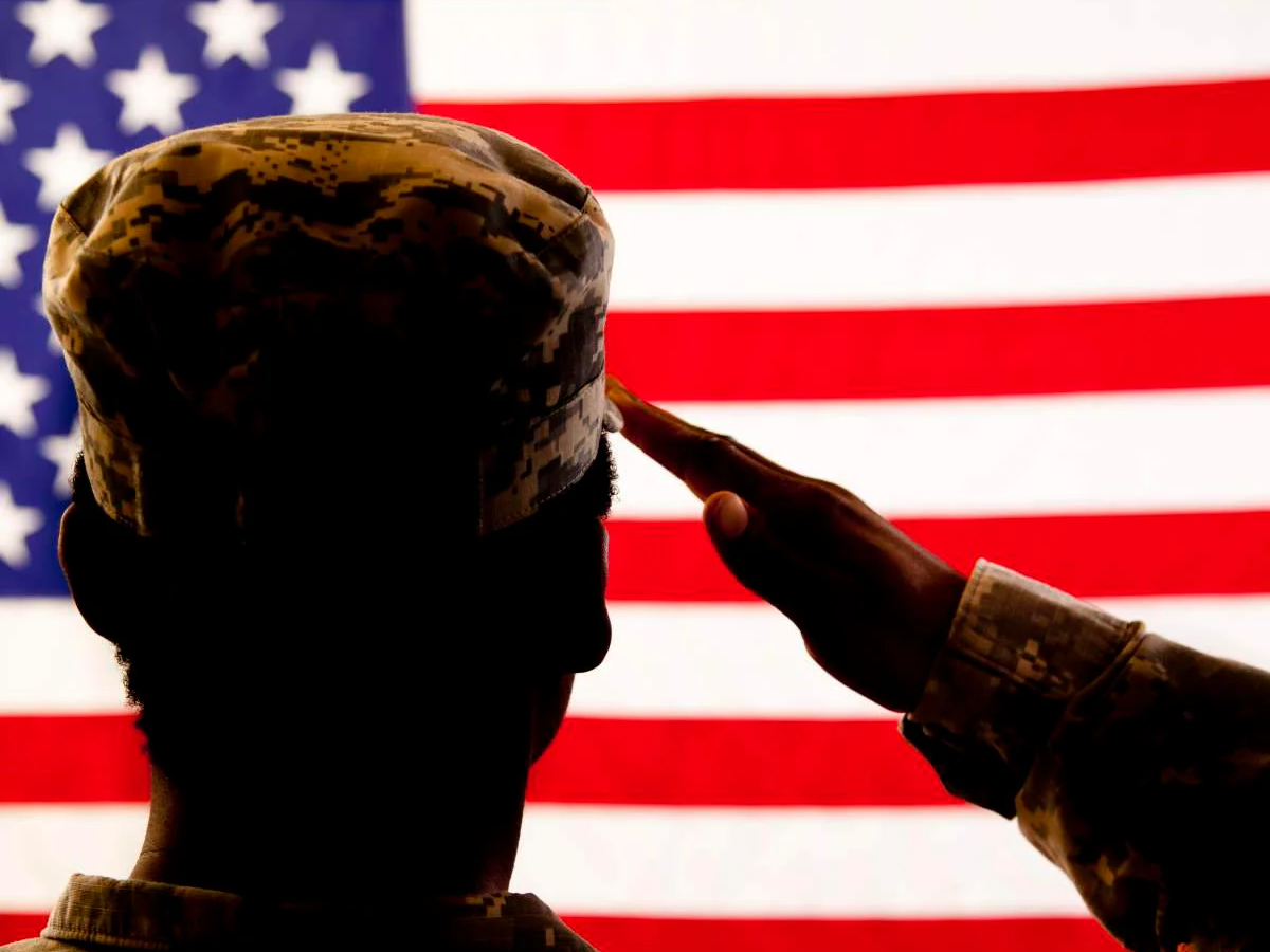 Solider saluting United States Flag