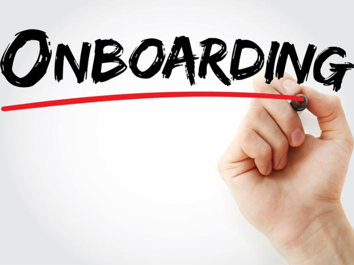 Onboarding, hand with marker underling onboarding in red